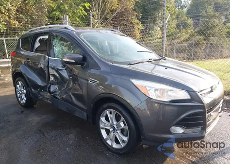2016 Ford Escape Titanium z USA, uszkodzony, nr VIN 1FMCU0JX8GUA49040